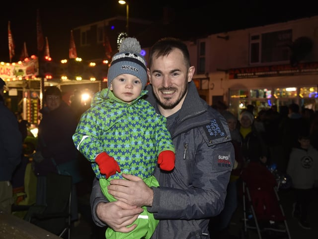 Lee-on-the-Solent Christmas lights were switched on in the High Street on Friday, November 24.Pictured is: Ash with his son Leo (2) from Gosport.Picture: Sarah Standing (241123-2371)