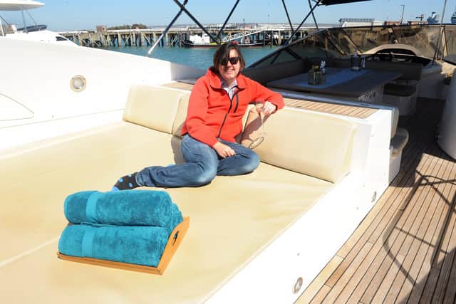 Features writer at The News, Chris Broom takes it easy with a glass of prosecco on board Chess.
Picture: Sarah Standing (230421-7225)
