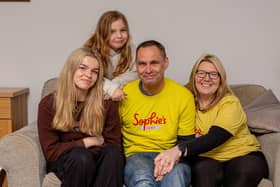 Sophie's legacy a year on. Story on Sophie Fairall's legacy and how far they have come since her funeral last year.

Pictured: Sophie's family, Lucy 16, Amelia 10, Gareth and Charlotte Fairall at their home in Stubbington on Monday 12th December 2022

Picture: Habibur Rahman