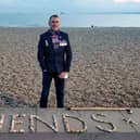Graham Culton leaves stone messages at Portsmouth seafront.