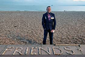 Graham Culton leaves stone messages at Portsmouth seafront.