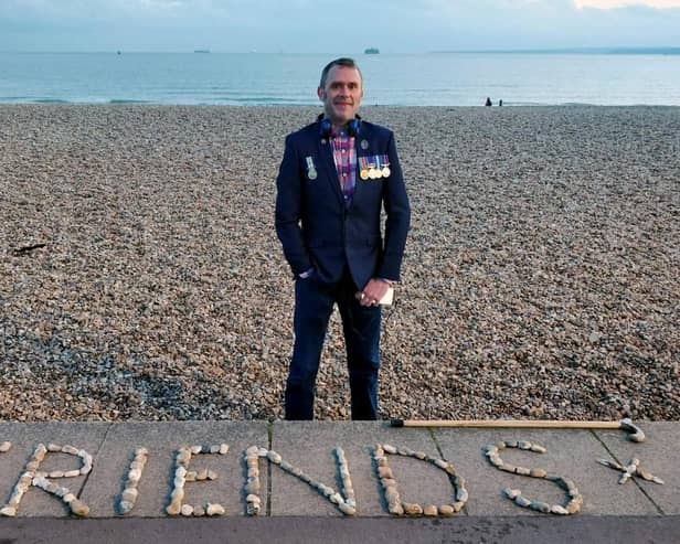 Graham Culton leaves stone messages at Portsmouth seafront.