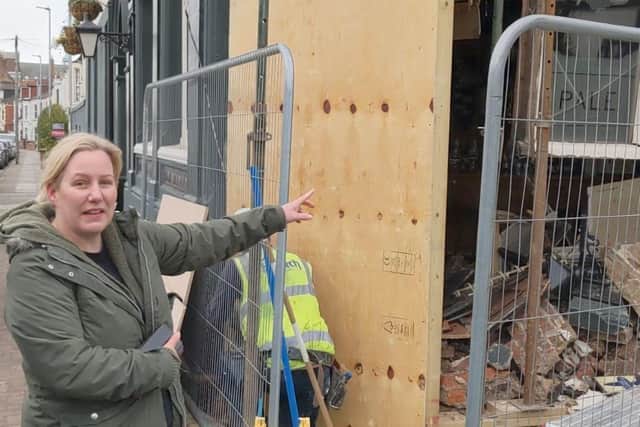 Lawrence Arms landlady Alison Wearn standing outside her pub hours after a car ploughed through one of its walls.