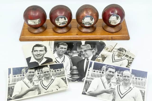 Mounted cricket balls and photos are among Derek Shackleton's memorabilia up for auction next month. Picture: Hansons