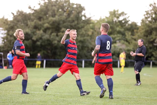 Shane Cornish, right, about to be congratulated by Gary Jeffrey after scoring for Paulsgrove against Liphook. Picture: Chris Moorhouse