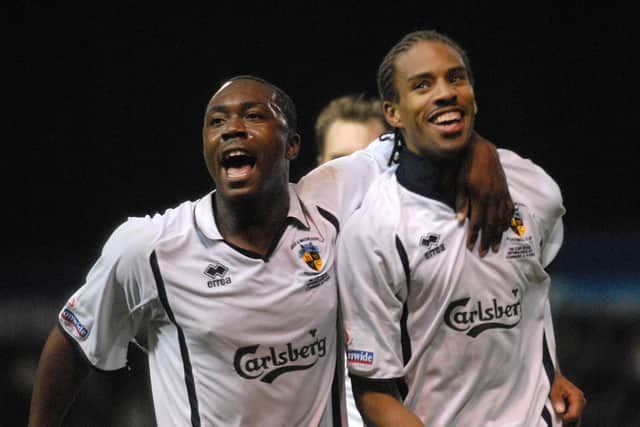 Richard Pacquette, left, and Rocky Baptiste celebrate Hawks' goal against Millwall in the FA Cup first round at Fratton Park in November 2006.
Picture: Mick Young
