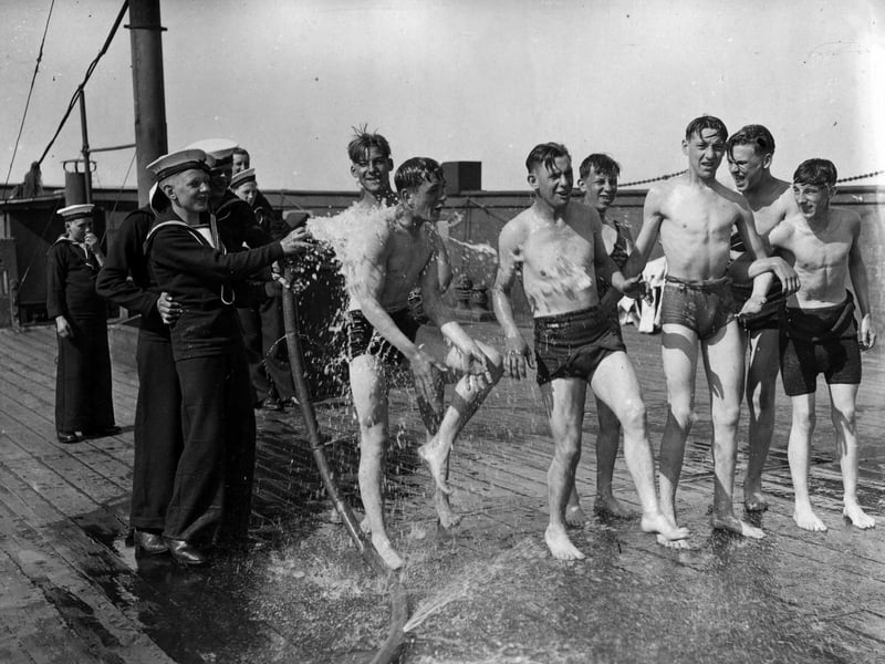 20th August 1936: Sea Cadets being soaked on board the training ship 'Implacable' in Portsmouth harbour. (Photo by E. Dean/Topical Press Agency/Getty Images)