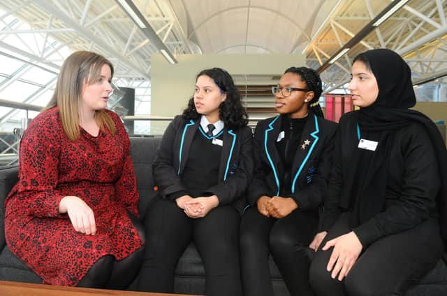 From left, Charlotte Seddon-Ellis from Lockheed Martin talking to Camila Almeida, 15, Wendy Ehigie, 15, and Atiya Ahmed, 16, from The Portsmouth Academy.
Picture: Sarah Standing (100320-7073)