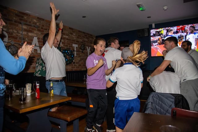 Fans celebrate England scoring against Senegal. Photos by Alex Shute.