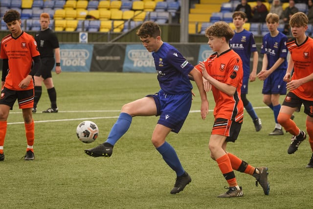 Action from the Portsmouth Youth League Stuart Madigan Cup final between Baffins Milton Rovers Vipers U14s (all blue kit) and AFC Portchester Vikings U14s (orange and black kit). Picture: Keith Woodland (190321-334)