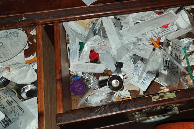 Drug paraphernalia in the living room of the boarded up flat in Trinity Close, Gosport. Picture: Gosport Borough Council.