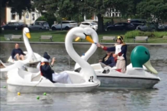 The battle of Canoe Lake - Comedian Al Murray, left, throws a ball at First Dates' host Fred Sirieix, right, from his swan-shaped pedalo in Canoe Lake. Photo: Instagram/Grayinpompey