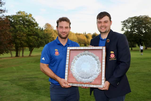 Lawrence Cherry, right, with his vice-captain Toby Burden (Hayling) after winning the South East League Final trophy. Picture: Andrew Griffin