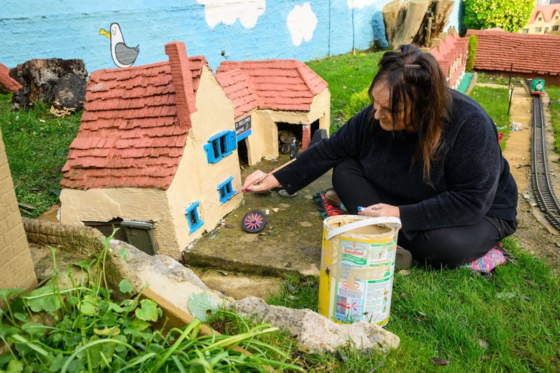 Pictured is: Janet Neil, former owner of the Model Village, restores one of the houses there.

Picture: Keith Woodland (100221-11)