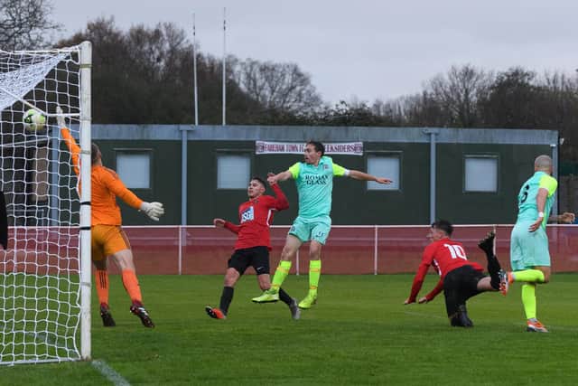 Calum Benfield, right, heads Fareham into the lead against Roman Glass St George. Picture: Keith Woodland