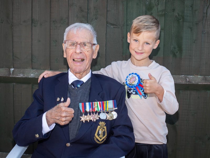 Pictured:  Reginald Plowman with grandson, James, 7.
