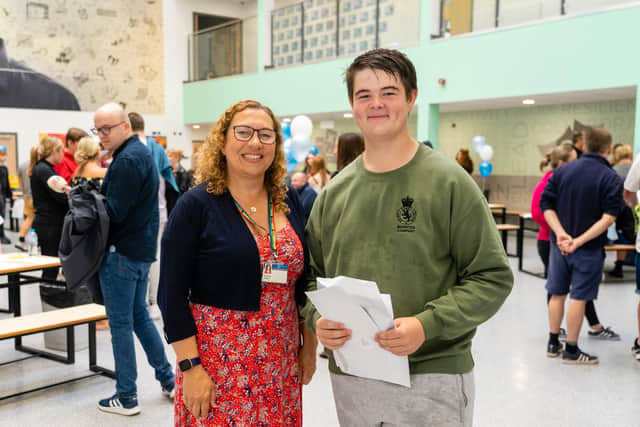 Portsmouth education secetary, Suzy Horton and Alfie Grimes holding GCSE results. Photo by Matthew Clark