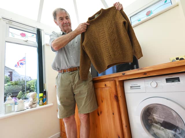 Derek Tolley of Fareham, was bought an expensive jumper by his  wife for Christmas. Despite following the washing instructions, it came out as a 'small' after washing. With the help of the Streetwise team on The News, Mr Tolley has now accepted a refund from the shop Picture: Chris Moorhouse (jpns 210523-04)