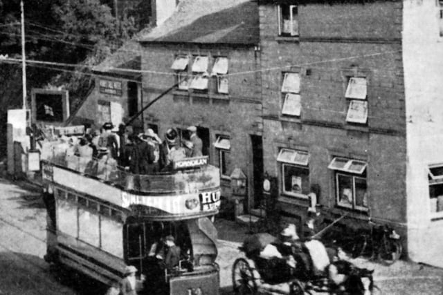 Passing The George on Portsdown Hill Summit. A tranquil scene at the summit of Portsdown Hill with a car for Horndean loaded with passengers. Picture: Courtesy Martin Petch