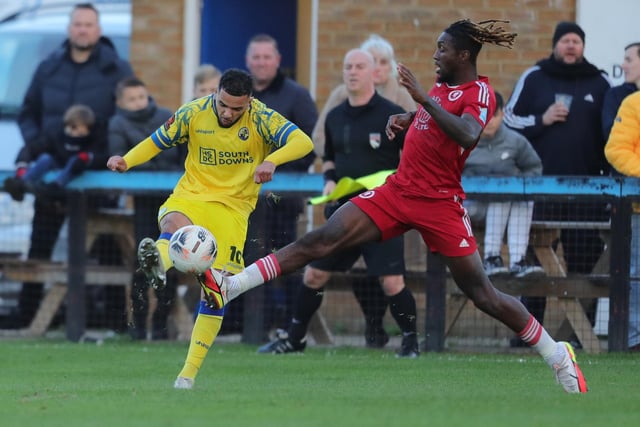 Hawks midfielder Billy Clifford, left, with two-goal Ade Azeez. Picture by Dave Haines
