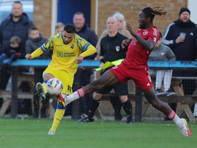 Hawks midfielder Billy Clifford, left, with two-goal Ade Azeez. Picture by Dave Haines