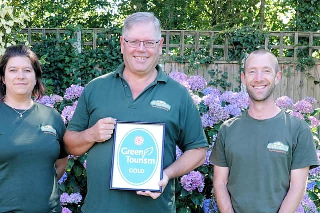 Stubcroft Farm Campsite's managing director Simon Green, centre, with operations manager Michaela Rozborilova, left and Mark Feast, sustainability and accessibility coordinator, right
