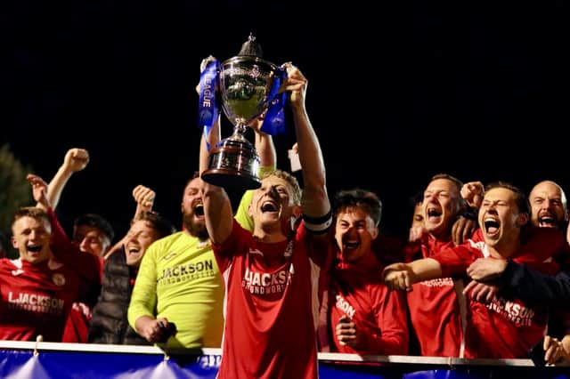 Horndean skipper Ash Howes with the Wessex League trophy. Picture by Martin Denyer