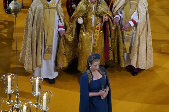 Penny Mordaunt carrying the Jewelled Sword of Offering.