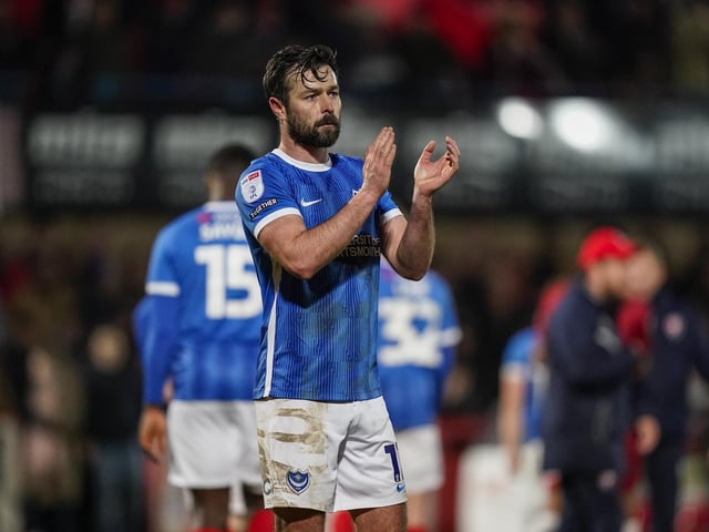 A disappointed Joe Rafferty applauds the travelling Fratton faithful at the final whistle
