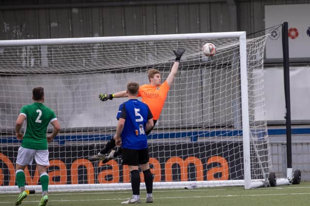 Clanfield keeper Ash Wright is beaten by Mackenzie Toms (out of picture) for Moneyfields' second goal. Picture: Alex Shute
