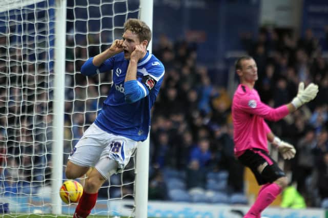 Ryan Bird celebrates his second goal during Pompey's 3-2 win over Exeter in November, 2013. Picture: Joe Pepler