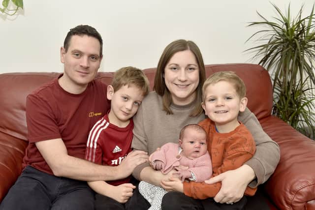 Emma and Stephen Collier from Wickham, have welcomed their third child, a daughter called Iris, who arrived ten days late on Christmas Day weighing 8lb 10oz. 
Pictured is: Stephen and Emma Collier with their three children George (7), Henry (4) and baby Iris who was born on Christmas Day at home.