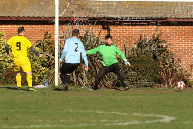 Co-Op Dragons (yellow/black) score against AFC Eastney. Picture: Kevin Shipp