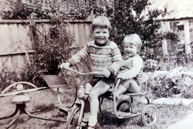 Kate Brown (right) with her found foster brother John (left) as children.
Picture: ITV