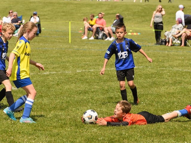 Action from the Clanfield youth football tournament at Horndean Technology College. Picture: Keith Woodland (270521-736)