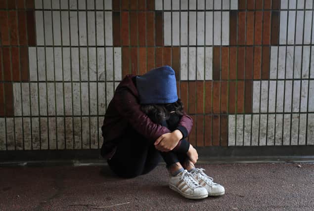 Picture posed by a model of a teenage girl showing signs of mental health issues. Photo: Gareth Fuller/PA Wire