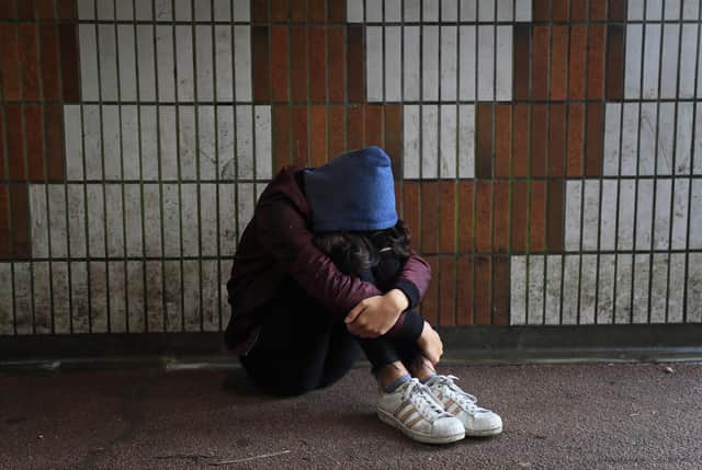 Picture posed by a model of a teenage girl showing signs of mental health issues. Photo: Gareth Fuller/PA Wire