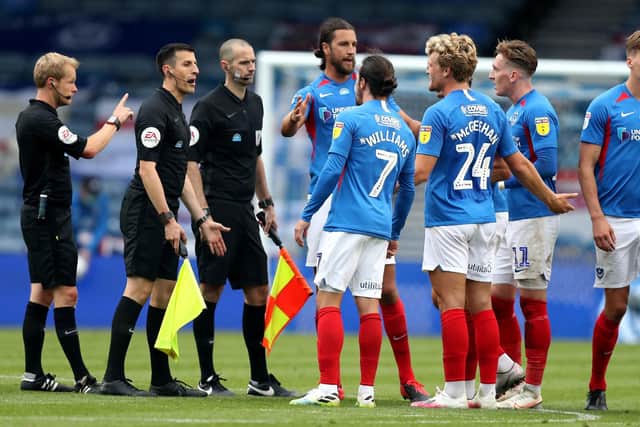 Pompey players speak to the match officials after the draw with Oxford. Picture: Andrew Matthews/PA Wire.