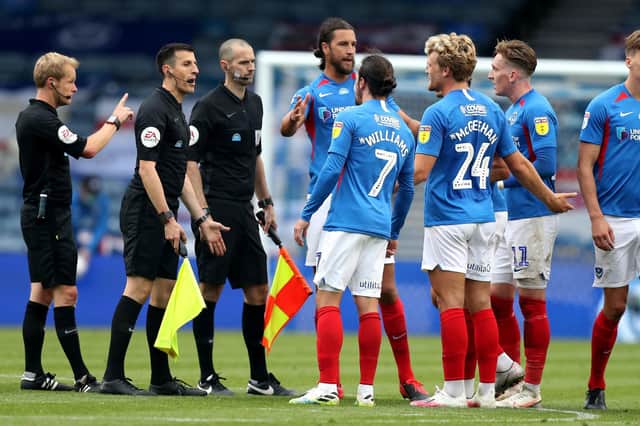 Pompey players speak to the match officials after the draw with Oxford. Picture: Andrew Matthews/PA Wire.