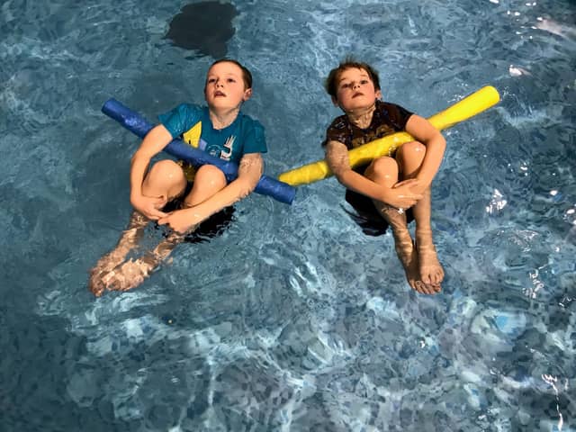 Little swimmers take part in a pajama class with Puddle Ducks. 