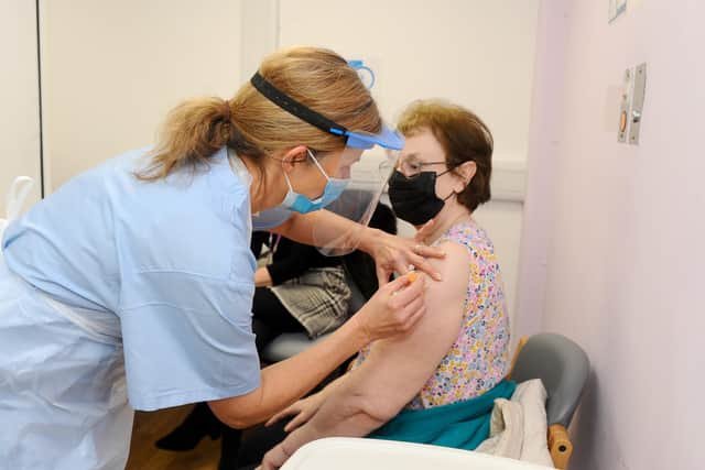 Diane Senior (74) from Cosham, having her vaccination. Picture: Sarah Standing (010221-1944)