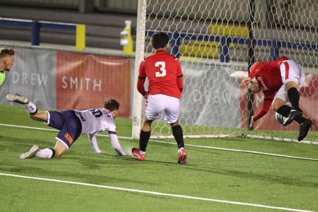 Joe Iaciofano heads in Hawks' fourth goal. Pic: Dave Haines.
