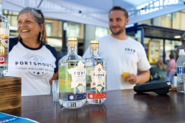 Free samples of home-brewed rum given out at the Portsmouth Distillery stall. Picture: Mike Cooter (160722)