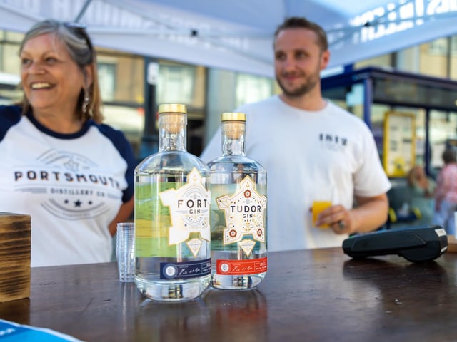 Free samples of home-brewed rum given out at the Portsmouth Distillery stall. Picture: Mike Cooter (160722)