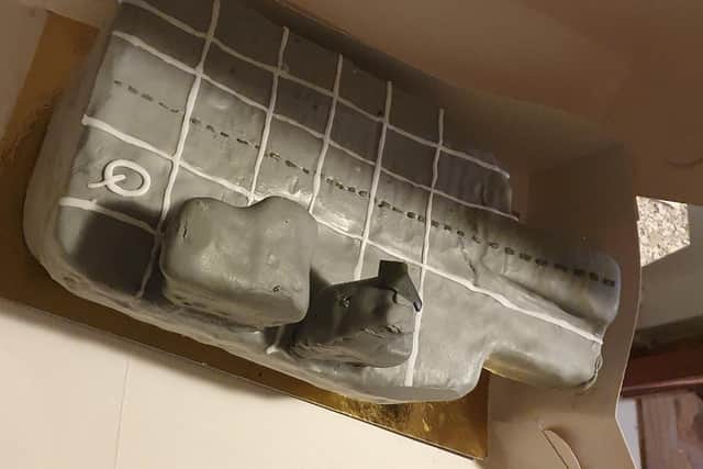 Shane Mason, 35, wanted the perfect HMS Queen Elizabeth aircraft carrier cake for his son Maxwell's eighth birthday party on February 29. But instead he got a 'monstrosity' of a cake. Shane told the baker to take it with her and refund his £60 deposit.
Pictured: The offending cake with a Q to indicate what it should have been