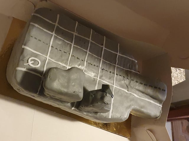 Shane Mason, 35, wanted the perfect HMS Queen Elizabeth aircraft carrier cake for his son Maxwell's eighth birthday party on February 29. But instead he got a 'monstrosity' of a cake. Shane told the baker to take it with her and refund his £60 deposit. Pictured: The offending cake with a Q to indicate what it should have been