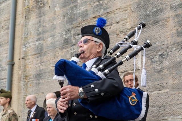 A piper at the Falklands Memorial Service at Old Portsmouth.