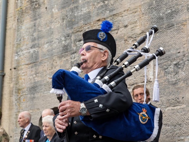 A piper at the Falklands Memorial Service at Old Portsmouth.