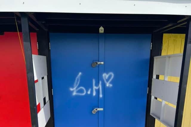 Vandals spray painted their names and logos on the beach huts, and across one of the paths. Picture: Southsea Model Village.