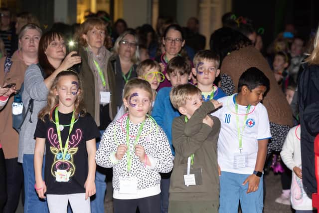 Rowans Starlit Walk at Historic Dockyard Portsmouth on Thursday 27th October 2022Pictured: Children warming up before the walk with a dancePicture: Habibur Rahman